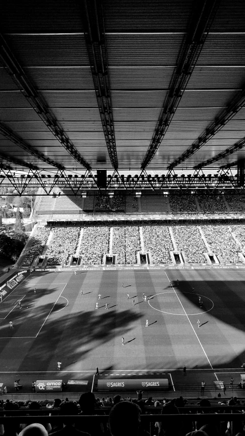 large crowd watching from inside a stadium filled with people