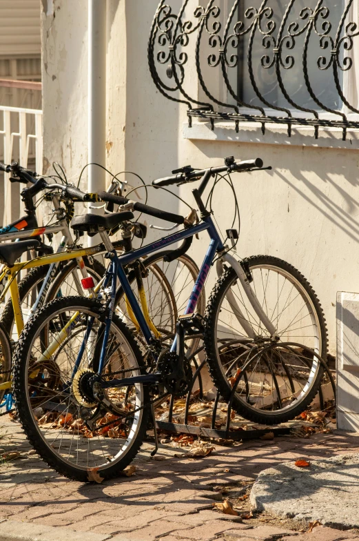 a bicycle parked in front of an ornate white wall