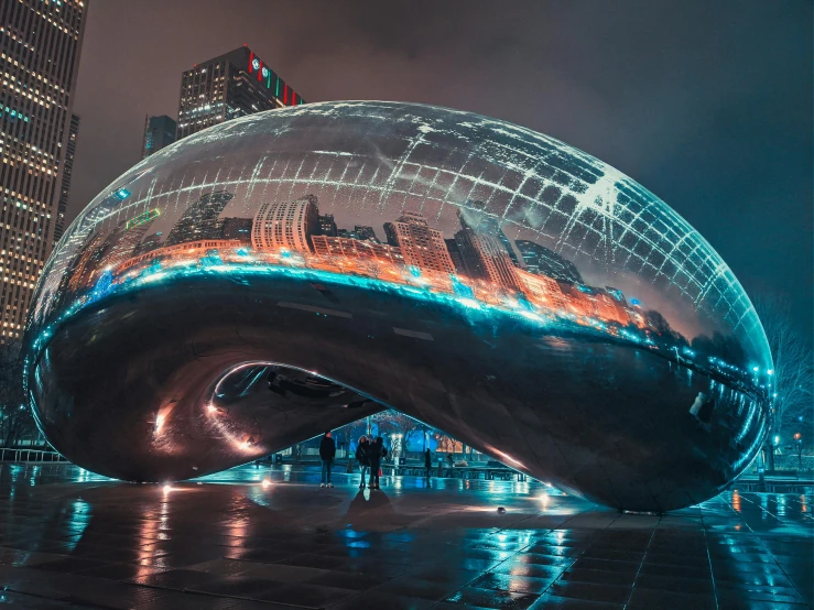 a huge glass ball in the middle of a building with lights on it