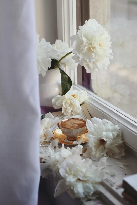 a vase that is sitting in front of a window