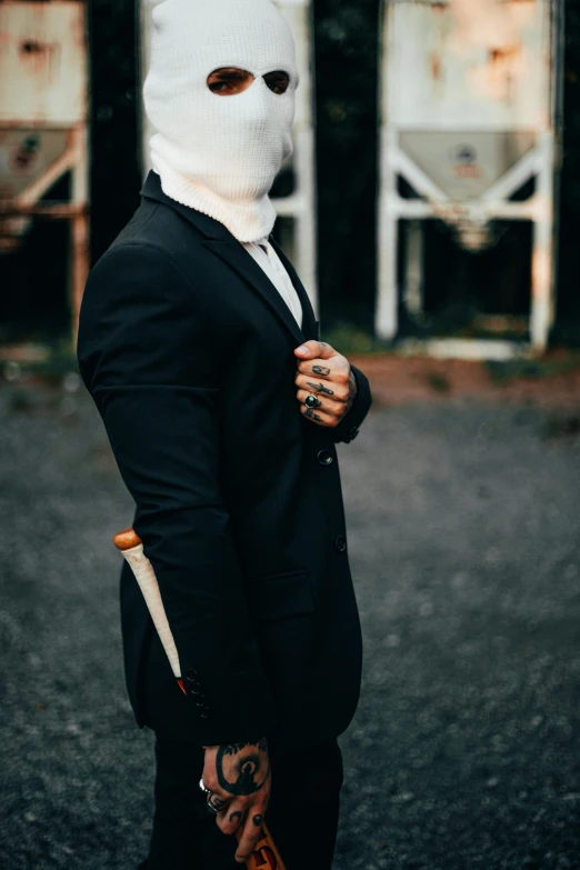 a man in a suit and mask
