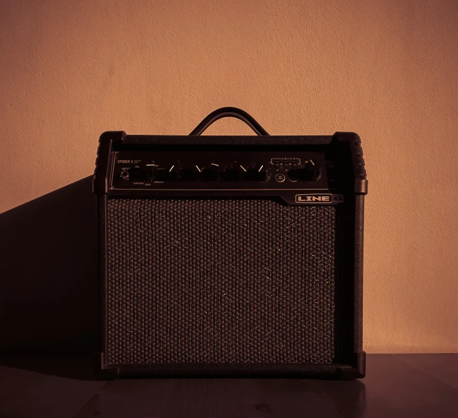an old amp with the shadow of its face