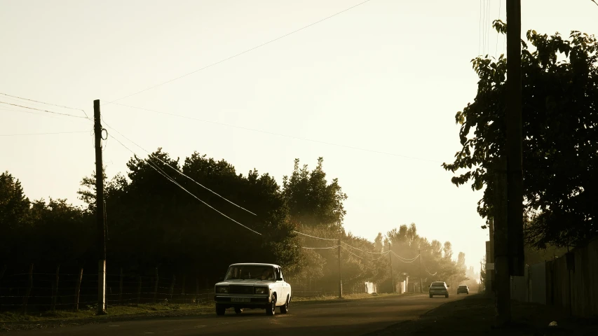 a black and white po of an old truck on the road