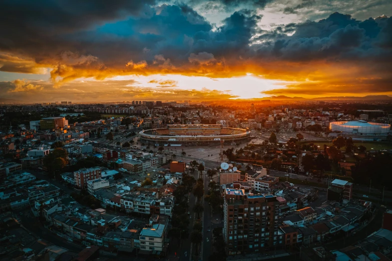 a city with lots of tall buildings and clouds