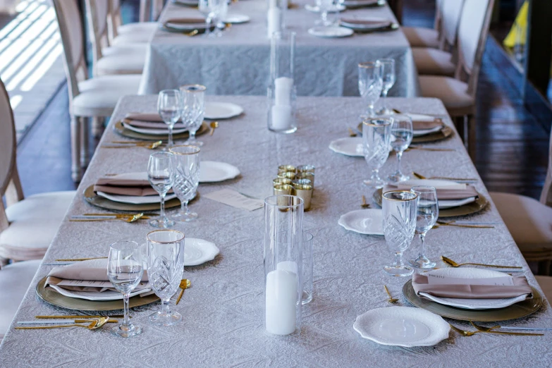 a table setting with a silver linen