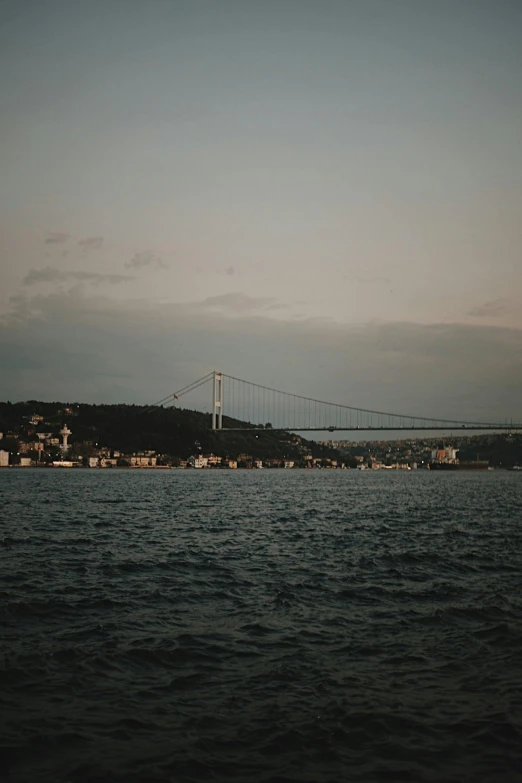 a view of a bridge with a river in front