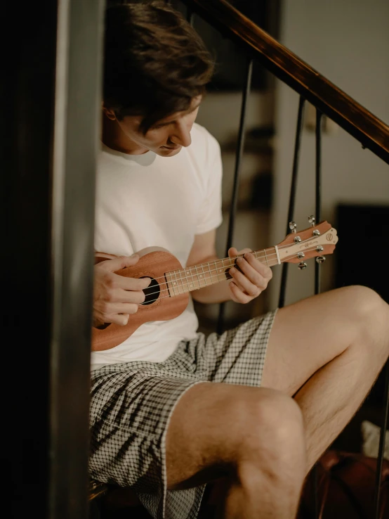 a person is playing a music instrument on the steps