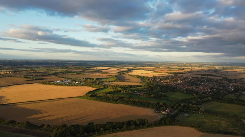 a small area of land that is under a cloudy sky