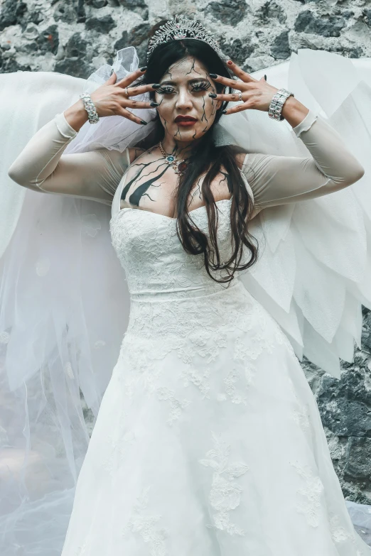 a woman in white wedding dress posing for po