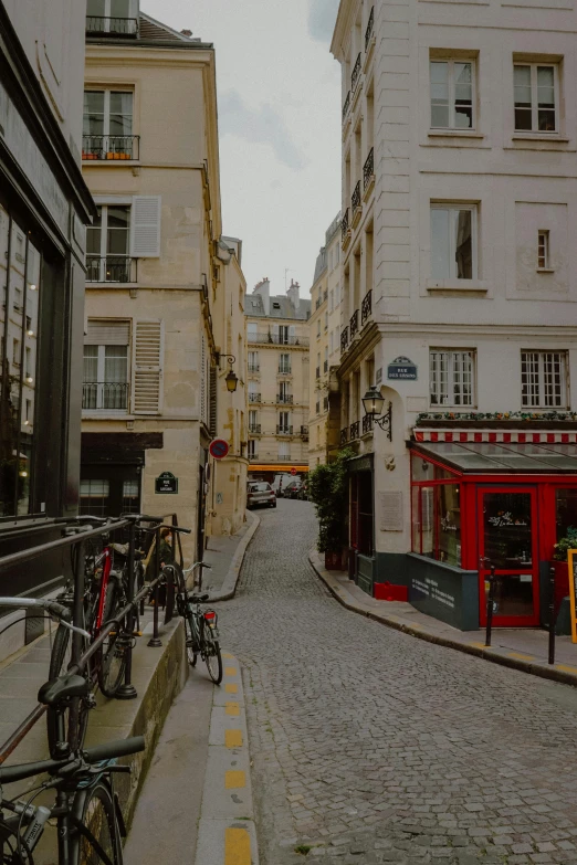 bicycles on the side of a cobblestone street