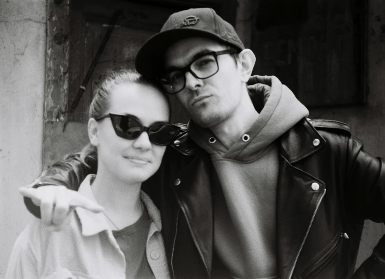 a couple taking selfies while wearing glasses