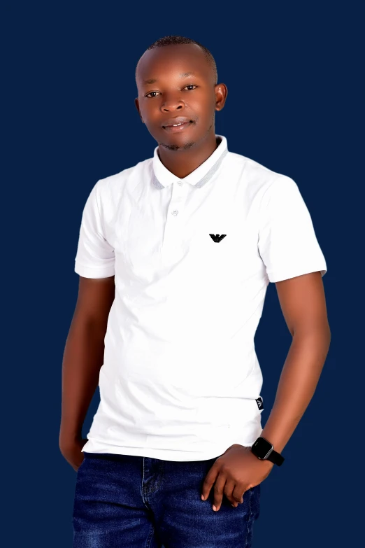 a young man wearing a white shirt and jeans