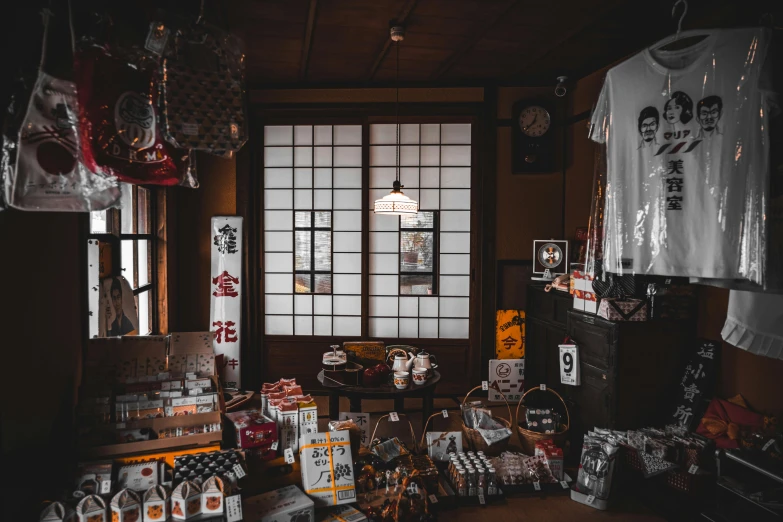 a store filled with a bunch of items next to windows