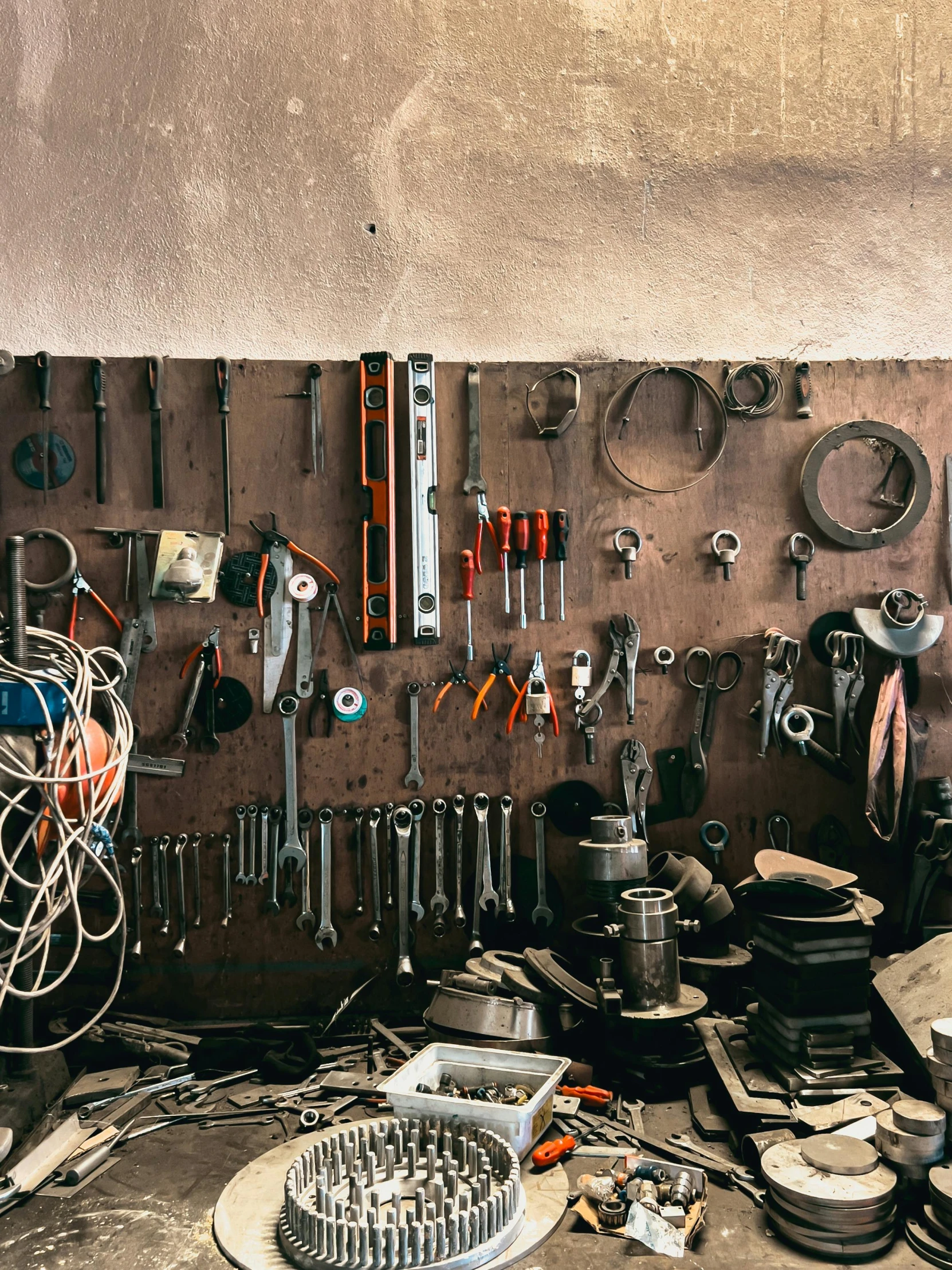 there are many different tools and screwdrivers arranged on a wall