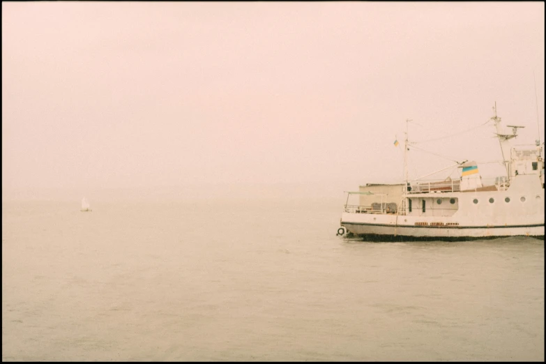 a boat on the water on a foggy day