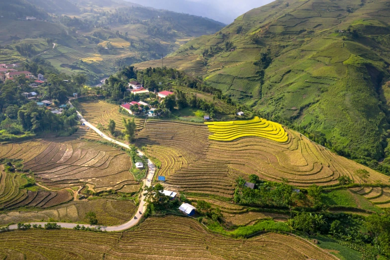 a scenic view of a valley surrounded by fields