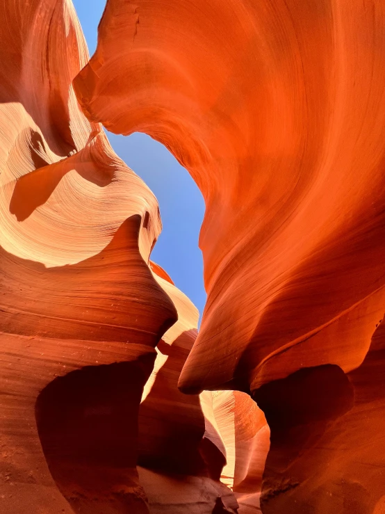 some tall red rocks and a bright blue sky