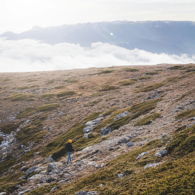 a lone hiker on a steep mountain