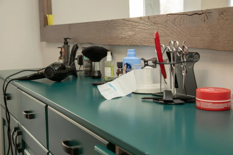 a desk that has a lot of office equipment on it