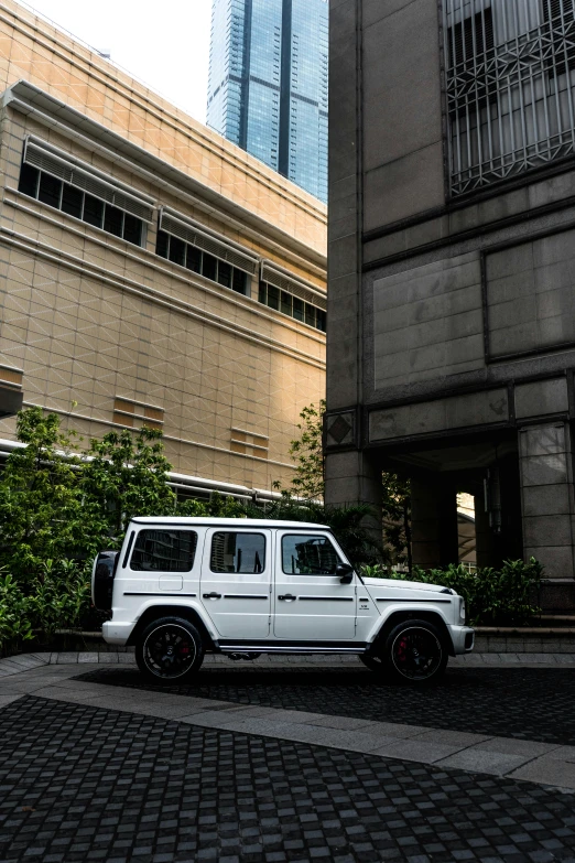 an suv parked near a building in a city