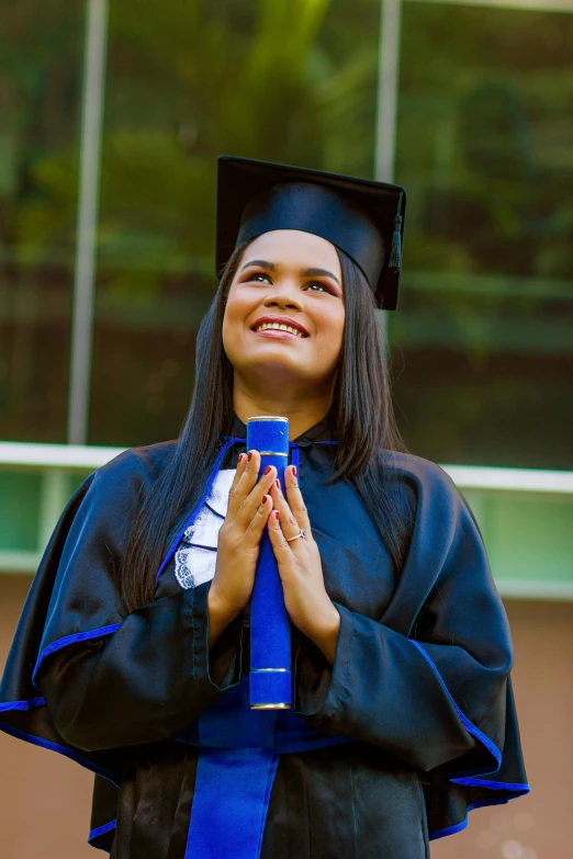 a  dressed in her graduation outfit