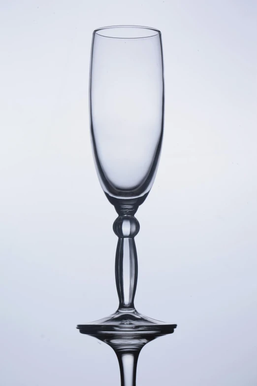 a glass that is up against a white background