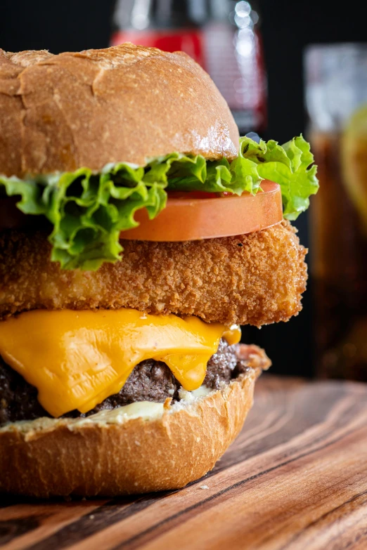 a big sandwich that is on top of a wooden surface