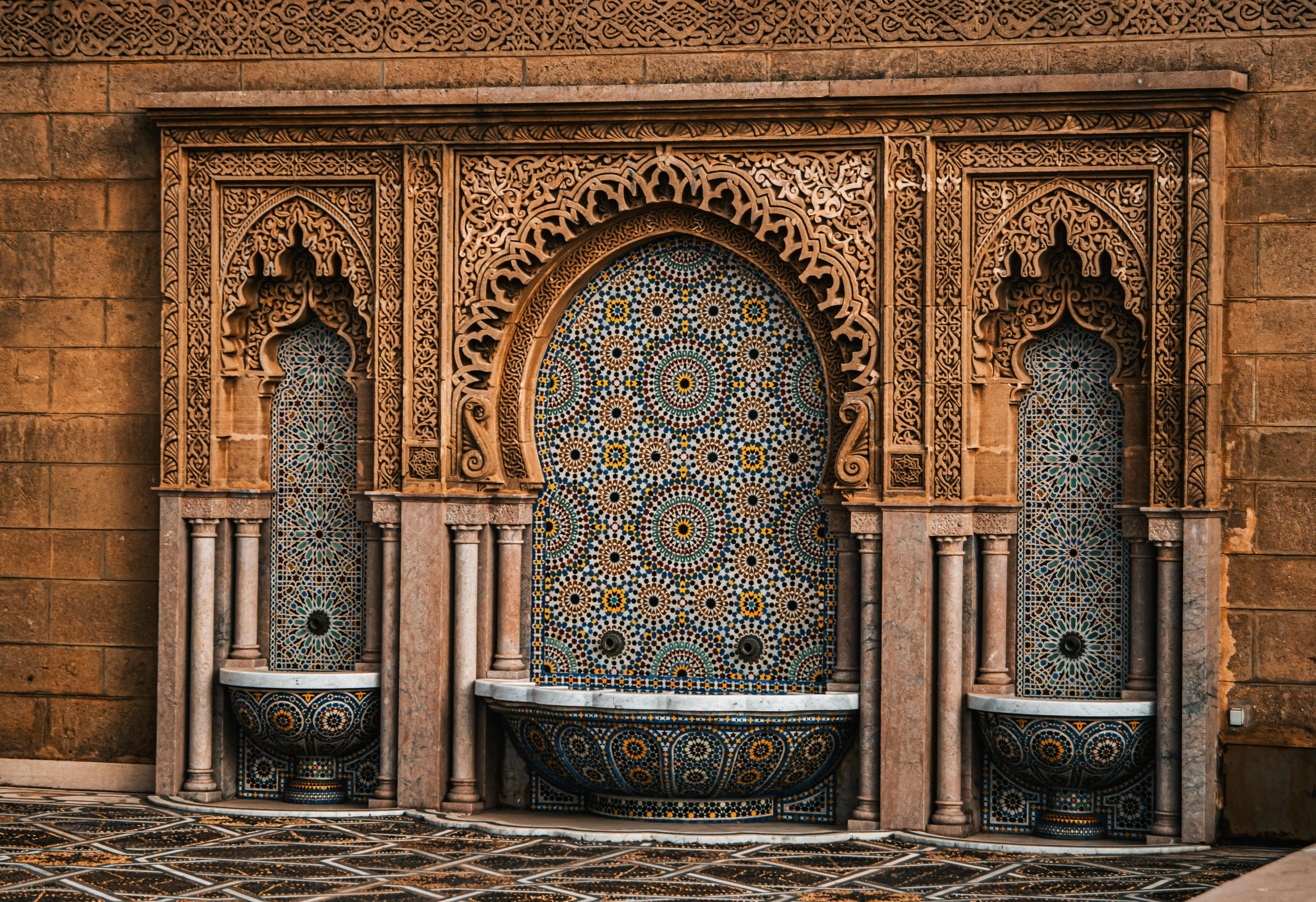 an ornate building that looks like it is surrounded by many columns