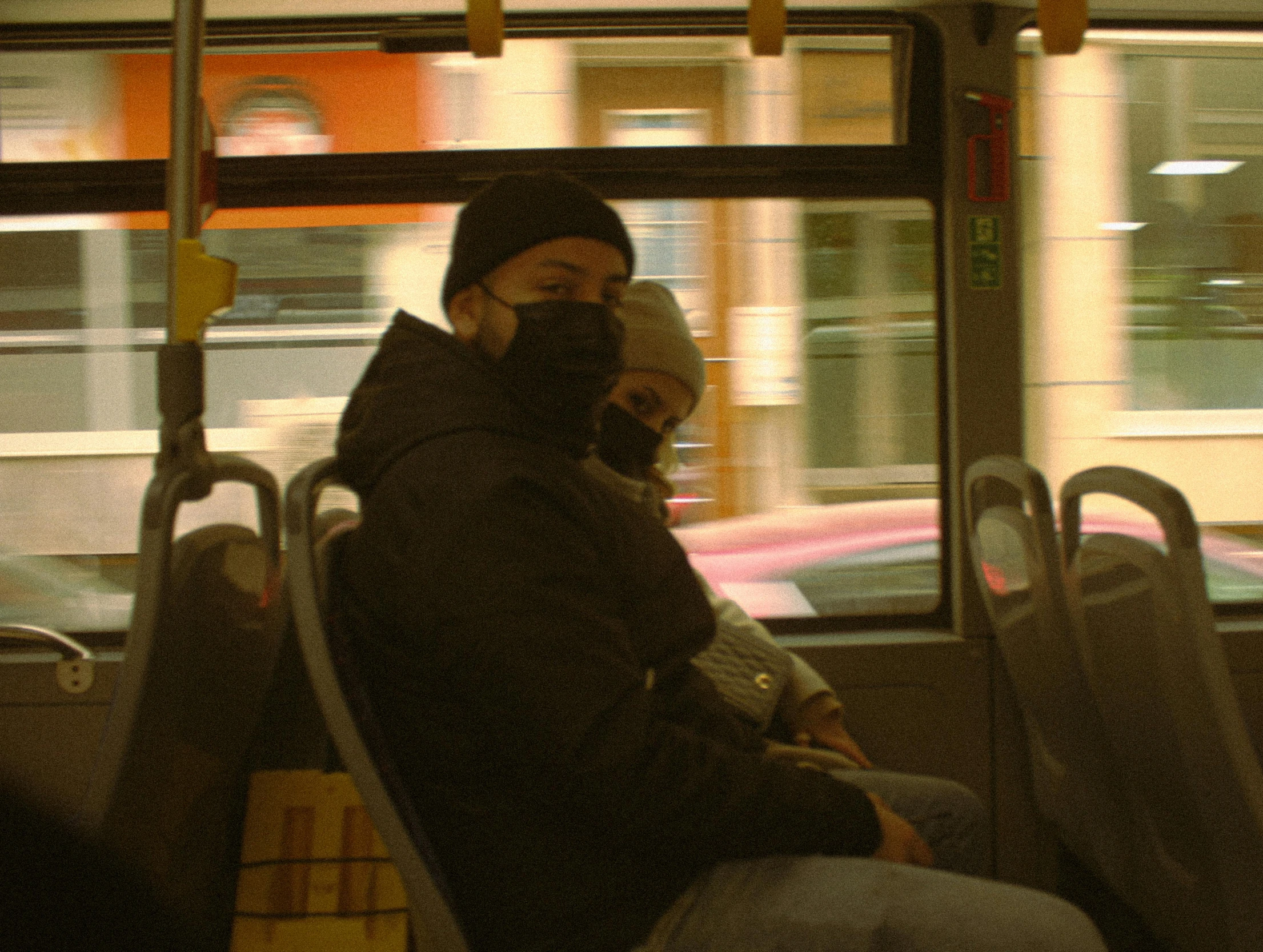 a woman on a bus talking on a cell phone