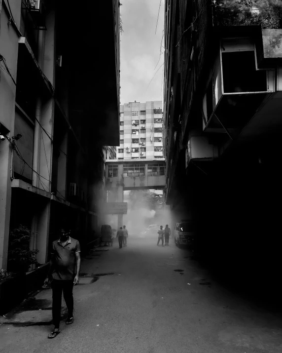 people walk through a narrow street in the city