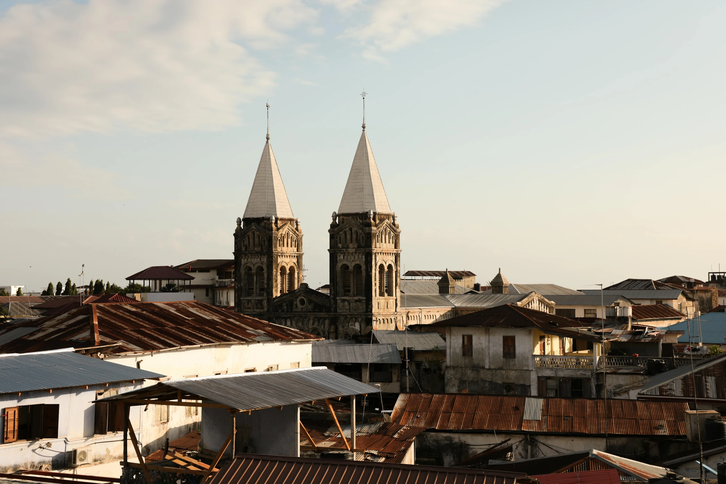 two spires in the back of some buildings