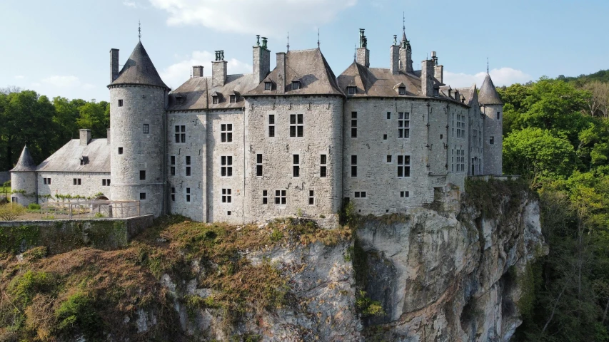 a castle on a hill near a cliff