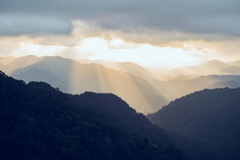 some very pretty mountains with some rays coming through