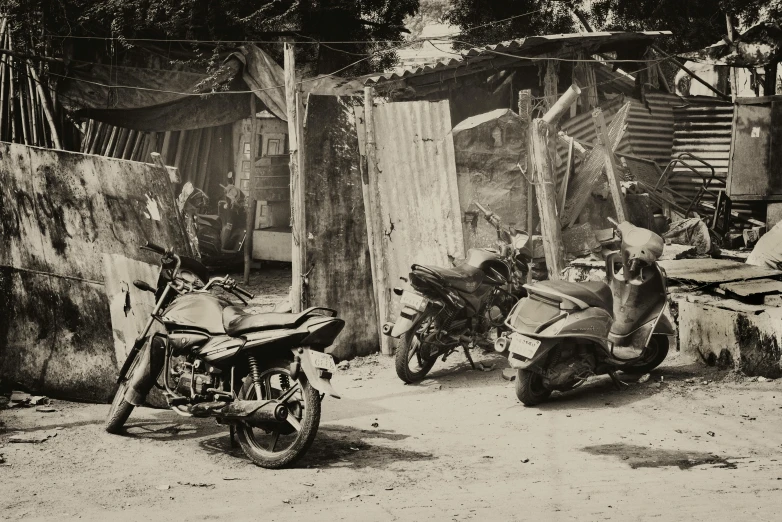 a couple of dirt bikes parked next to each other