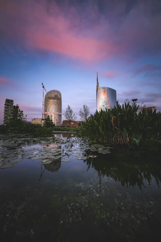 buildings on a lake with reflections in the water