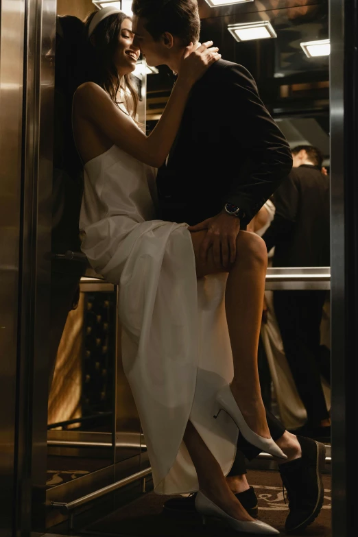 a man and woman sitting next to each other in a subway