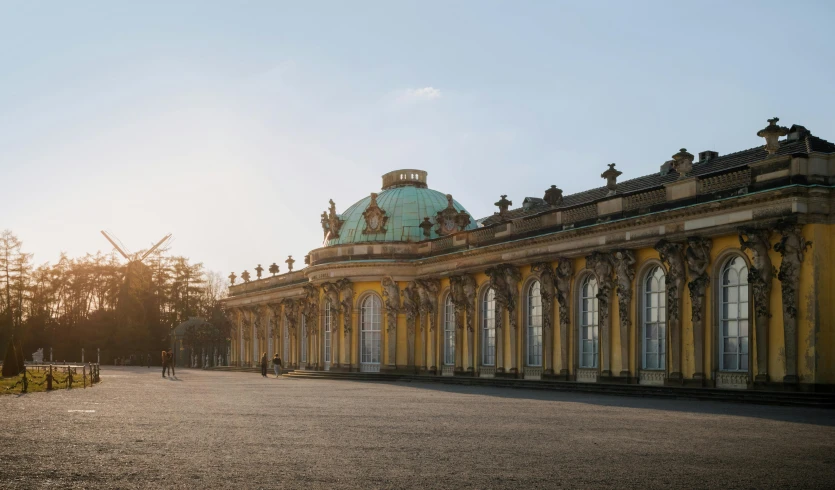 there is a large old building with people standing in front