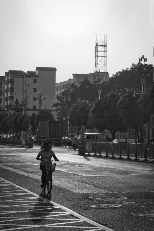 a person is riding a bicycle across the street