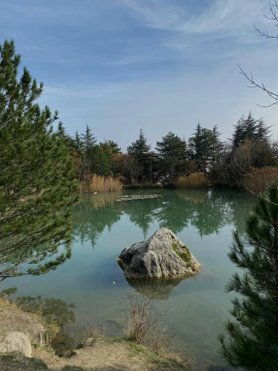 a lake surrounded by trees and water