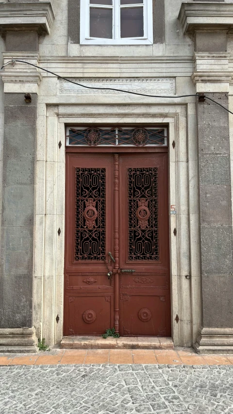 a pair of doors that are on a building