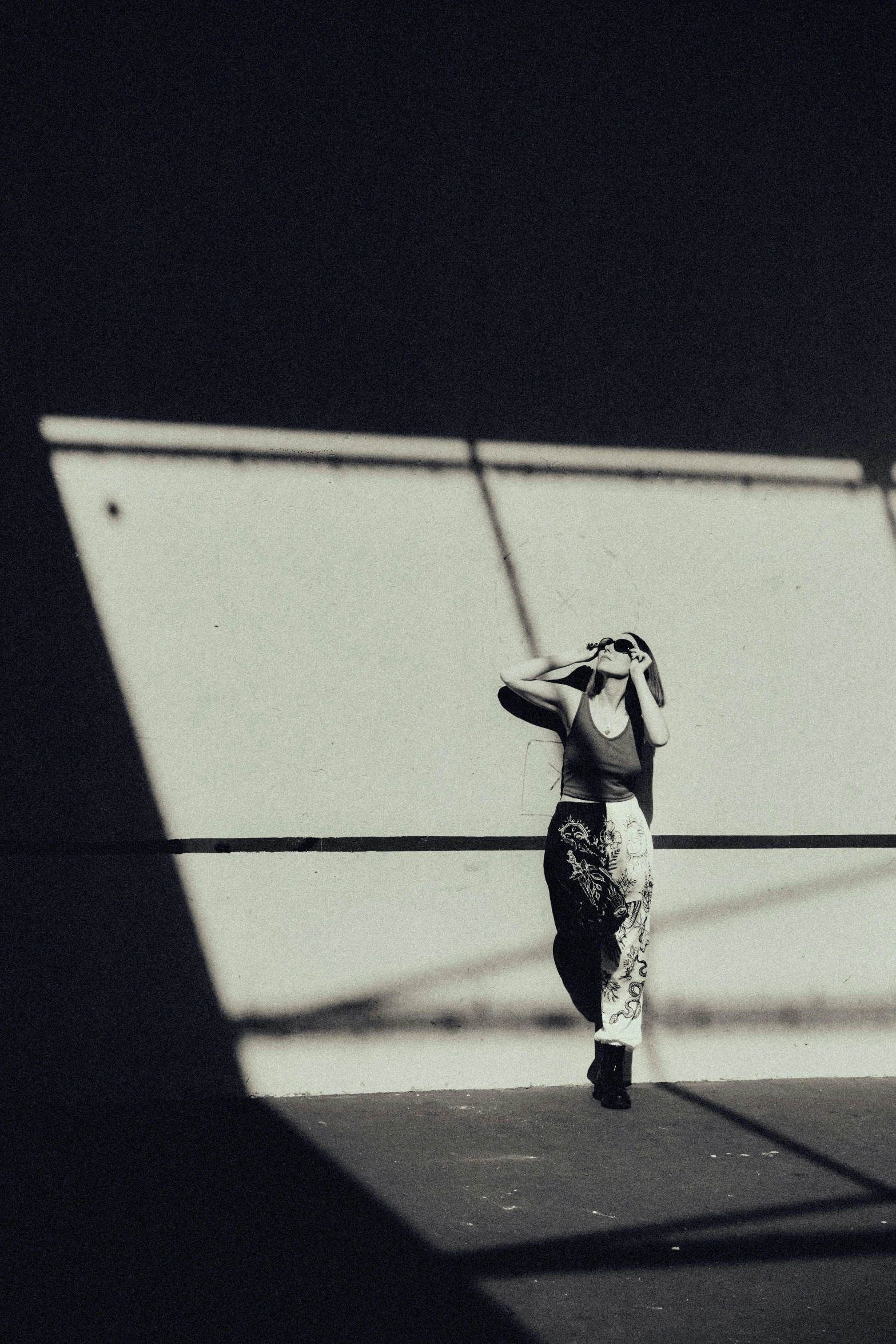 a woman in an artistic costume looking up into the sky