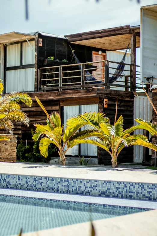 an empty swimming pool surrounded by wooden homes