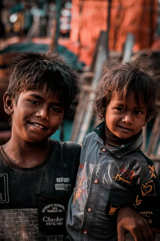 two young children are standing next to each other