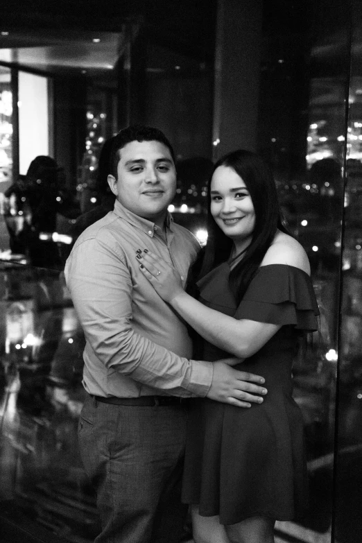 a couple in front of a city skyline