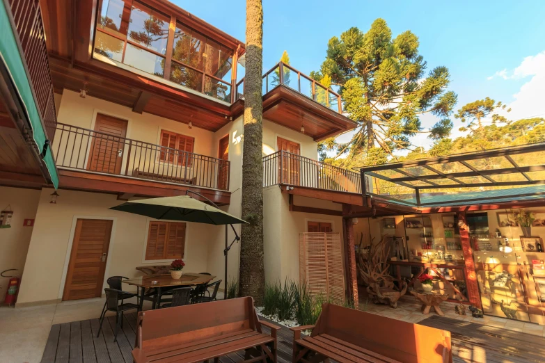 an outdoor seating area on a patio in a wooden building