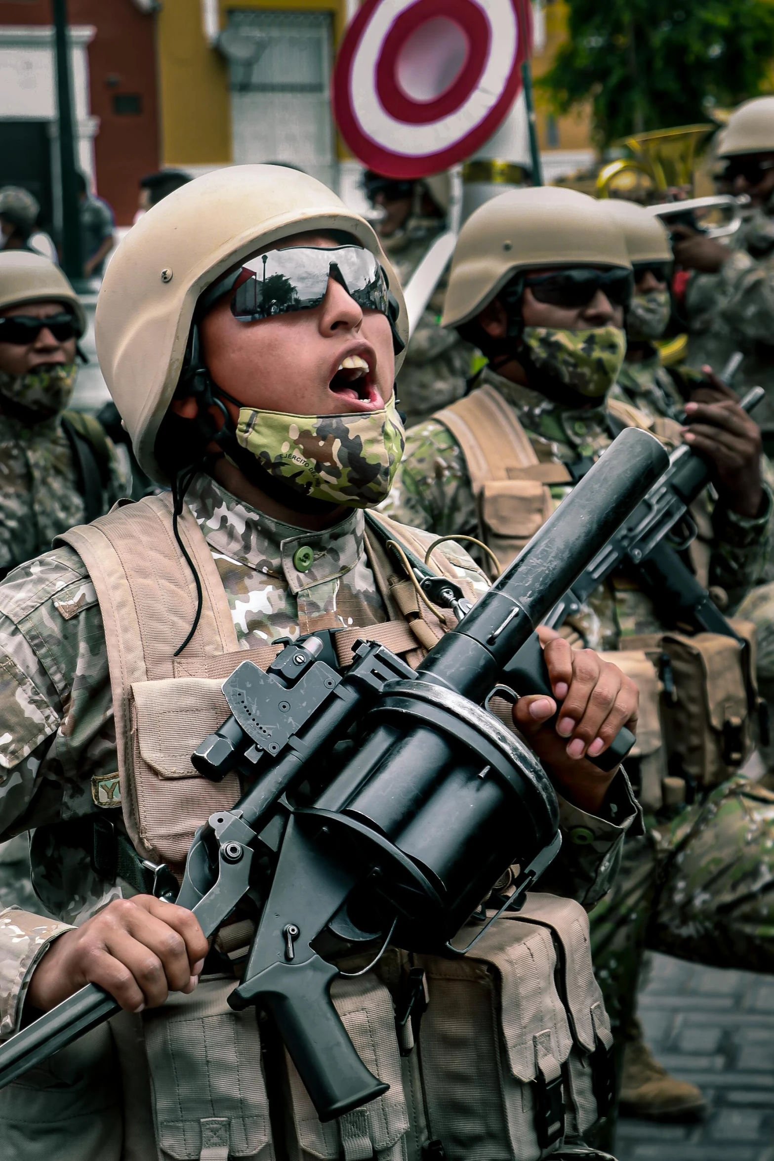 several soldiers dressed in military fatigues, some holding guns