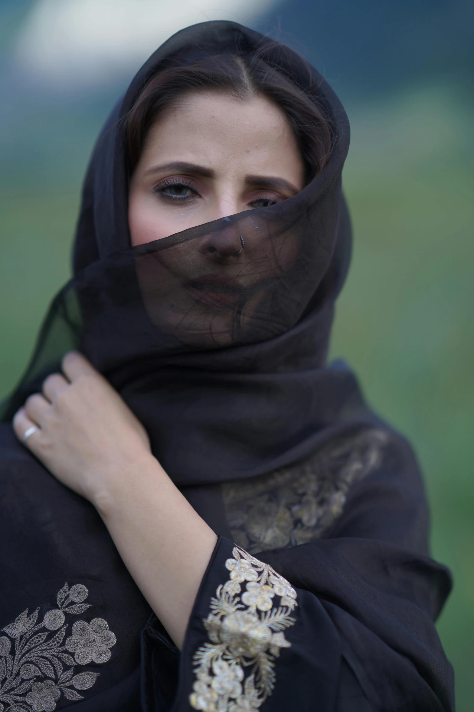 woman in traditional black dress wearing a veil