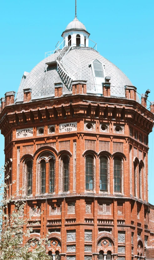 an old building with a clock in the middle