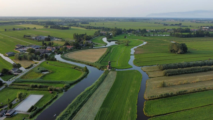 an aerial view of a long, winding waterway in the middle of a countryside