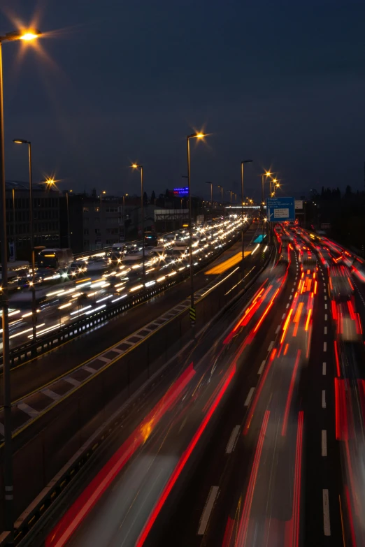 traffic going through an intersection with lots of lights on